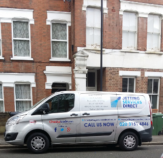 Investigating blocked drains at flat in Northlands Street, Camberwell SE5
